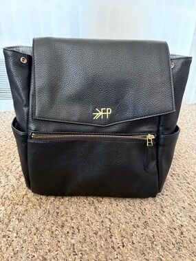 Black Backpack with Gold Logo and Zipper